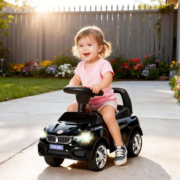 Carro Andador para Crianças de 18-36 Meses com Faróis Música Buzina Volante Compartimento de Armazenamento e Alça para Empurrar 63,5x28x36 cm Preto